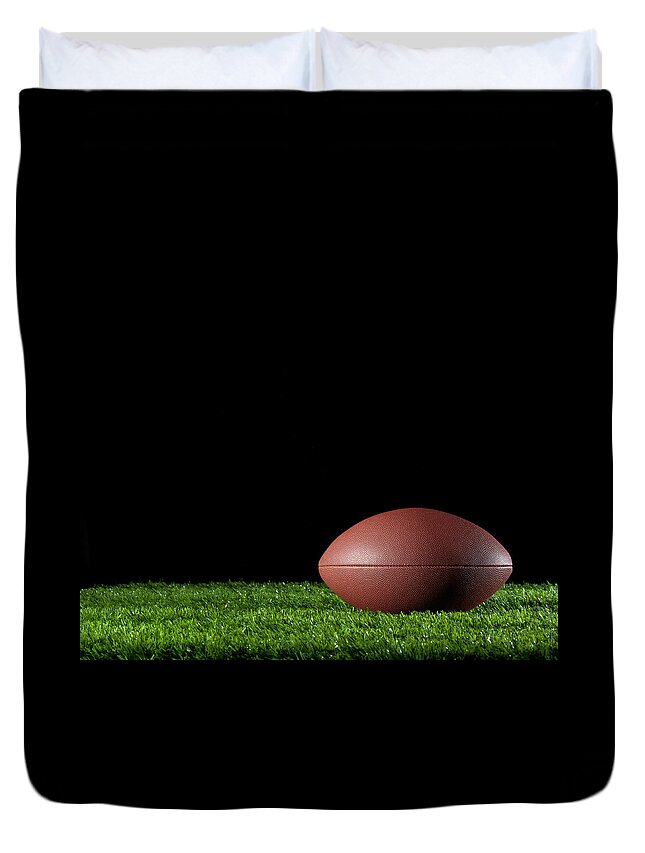 Shadow Duvet Cover featuring the photograph Gridiron Ball On The Grass At Night by Courtneyk