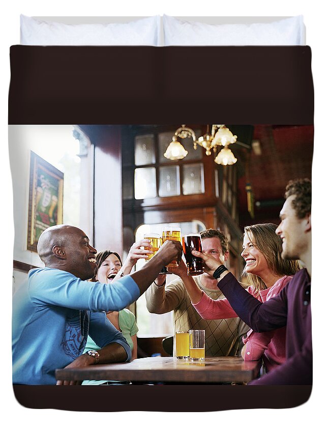 Young Men Duvet Cover featuring the photograph Group Of Friends Around Pub Table by Digital Vision