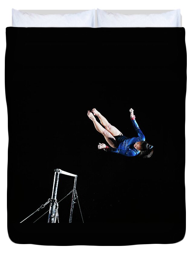 Expertise Duvet Cover featuring the photograph Gymnast 16-17 Dismounting Uneven Bars by Thomas Barwick