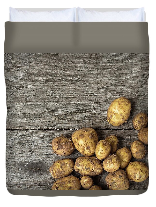 Desk Duvet Cover featuring the photograph Homegrown Potatoes On An Old Wood Table by Infrontphoto