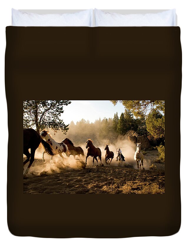 Horse Duvet Cover featuring the photograph Horses Being Chased By Cowboy Through by Garyalvis