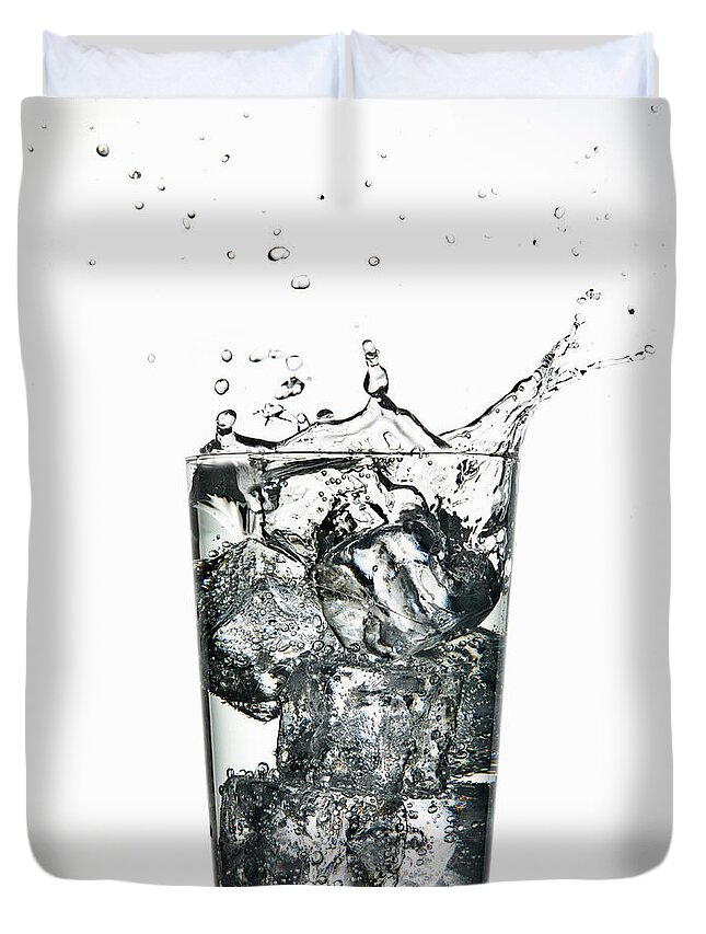 White Background Duvet Cover featuring the photograph Ice Cubes Splashing Into Fizzy Drink by Walter Zerla