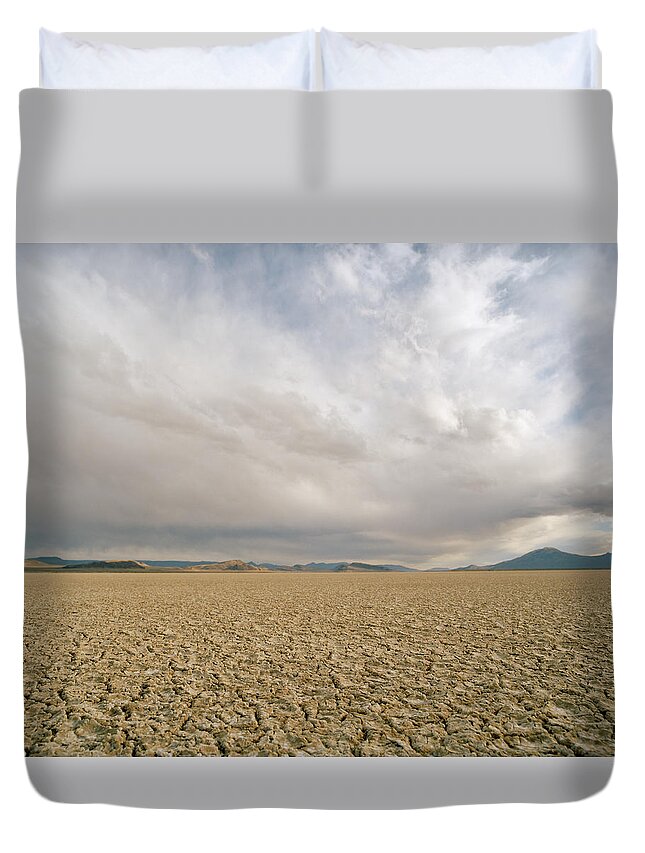 Scenics Duvet Cover featuring the photograph Idaho Desert, Dry Lake Bed With Clouds by Matthias Clamer