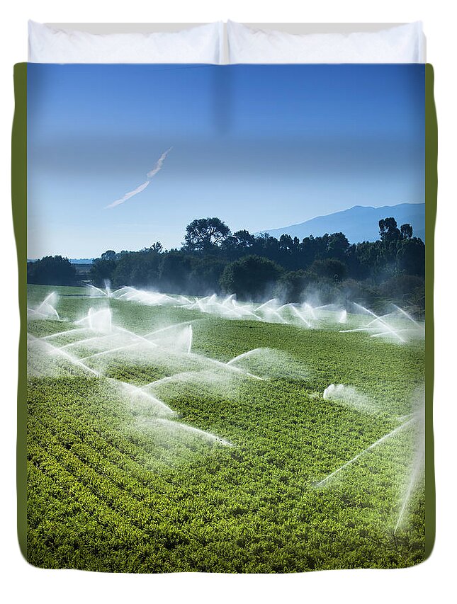 Environmental Conservation Duvet Cover featuring the photograph Irrigation Sprinkler Watering Crops On by Pgiam