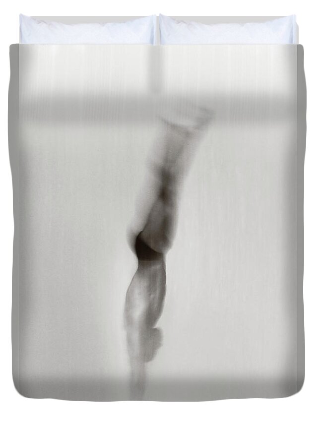 Diving Into Water Duvet Cover featuring the photograph Male Diver Diving Blurred Motion B&w by David Madison