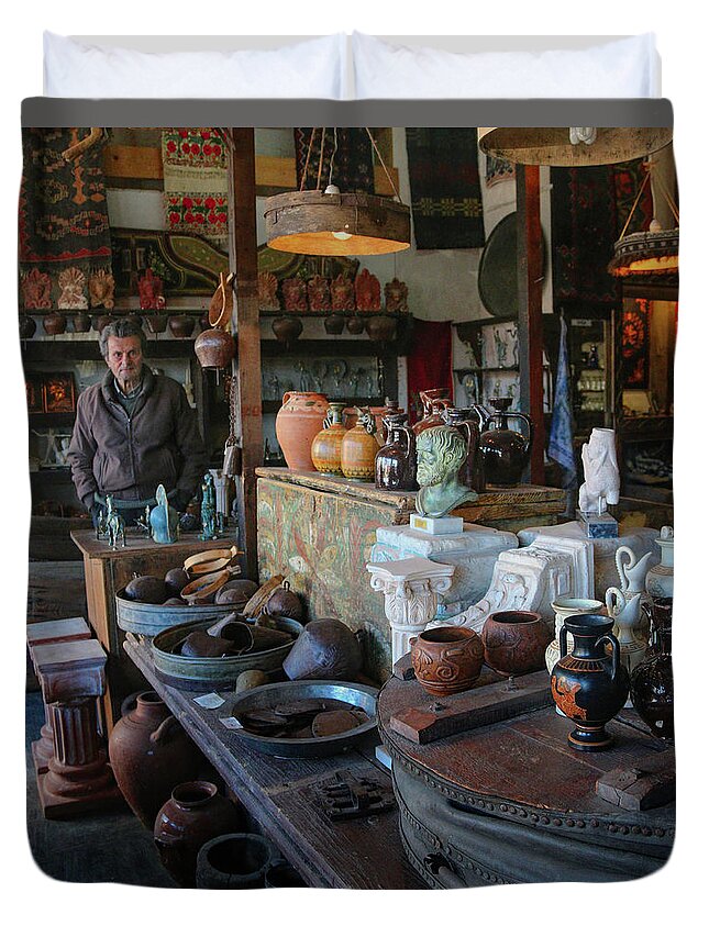 Greece Duvet Cover featuring the photograph Man in Shop in Delphi by M Kathleen Warren