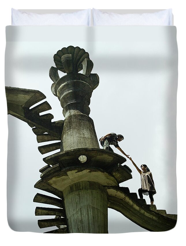 Mid Adult Women Duvet Cover featuring the photograph Man Leading A Woman Up A Surreal by Hans Neleman