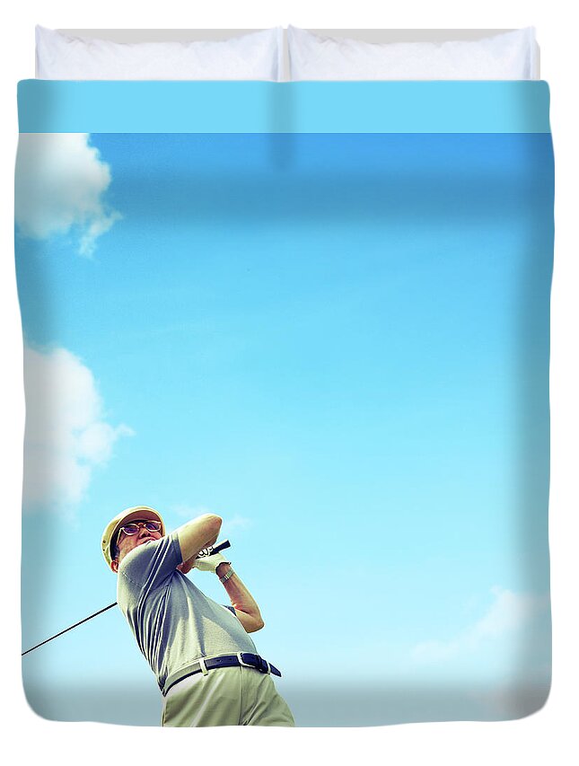 Tranquility Duvet Cover featuring the photograph Man Playing Golf by Bloom Image