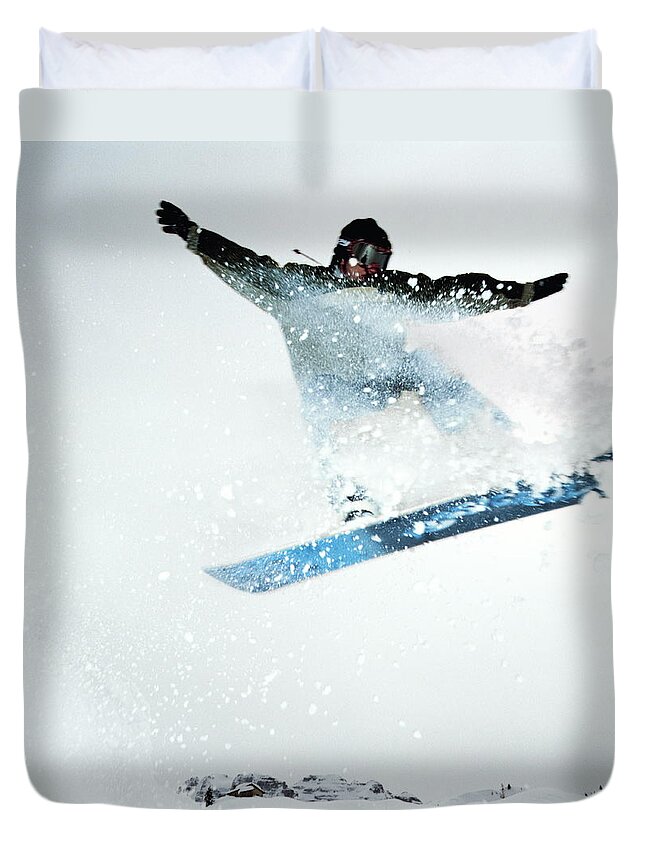 Human Arm Duvet Cover featuring the photograph Man Snowboarding, Mid-jump by Martin Barraud