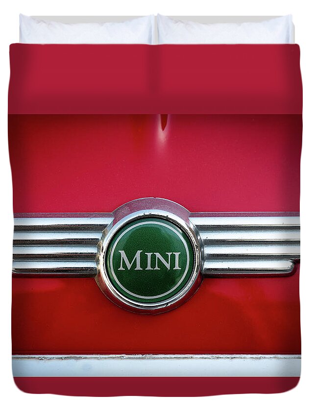 Mini Duvet Cover featuring the photograph Mini Cooper car logo on red surface by Michalakis Ppalis