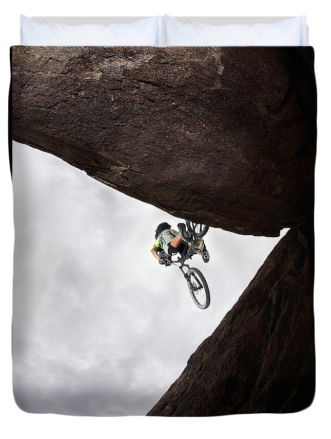 Recreational Pursuit Duvet Cover featuring the photograph Mountain Bike Rider Jumping Over Gap by Thomas Northcut