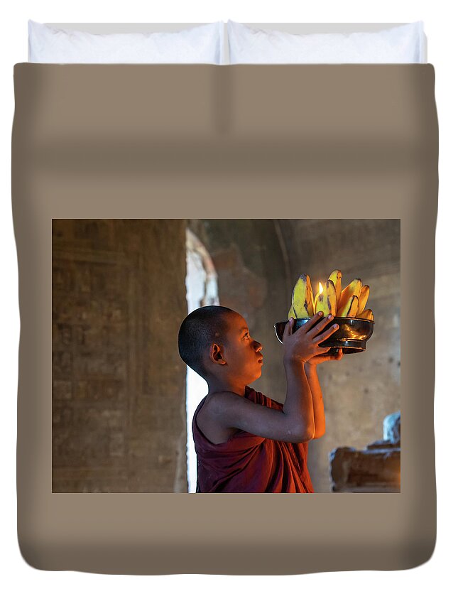 Boy Duvet Cover featuring the photograph Novice Monk Making An Offering by Ann Moore
