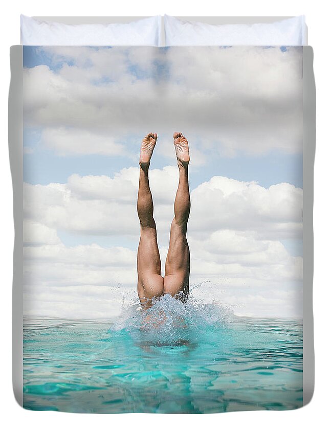 Diving Into Water Duvet Cover featuring the photograph Nude Man Diving by Ed Freeman