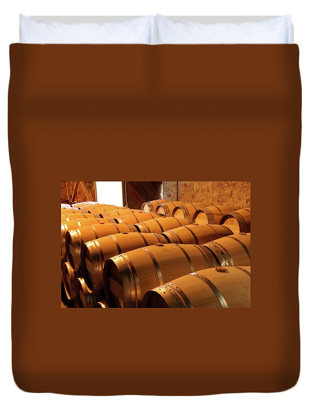 Fermenting Duvet Cover featuring the photograph Oak Wine Barrel Rows In Winery Cellar by Yinyang
