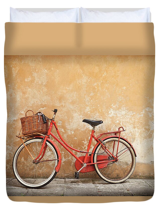 Leaning Duvet Cover featuring the photograph Old Red Bike Against A Yellow Wall In by Romaoslo
