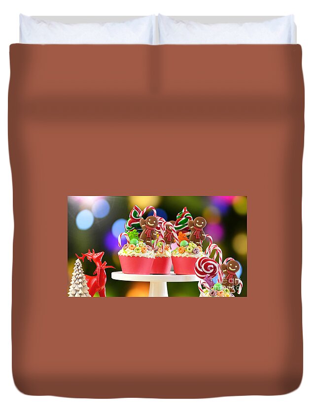 Christmas Duvet Cover featuring the photograph On trend candy land festive Christmas cupcakes. by Milleflore Images