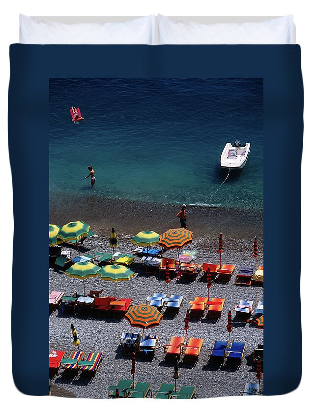 Shadow Duvet Cover featuring the photograph Overhead Of Unmbrellas, Deck Chairs At by Dallas Stribley