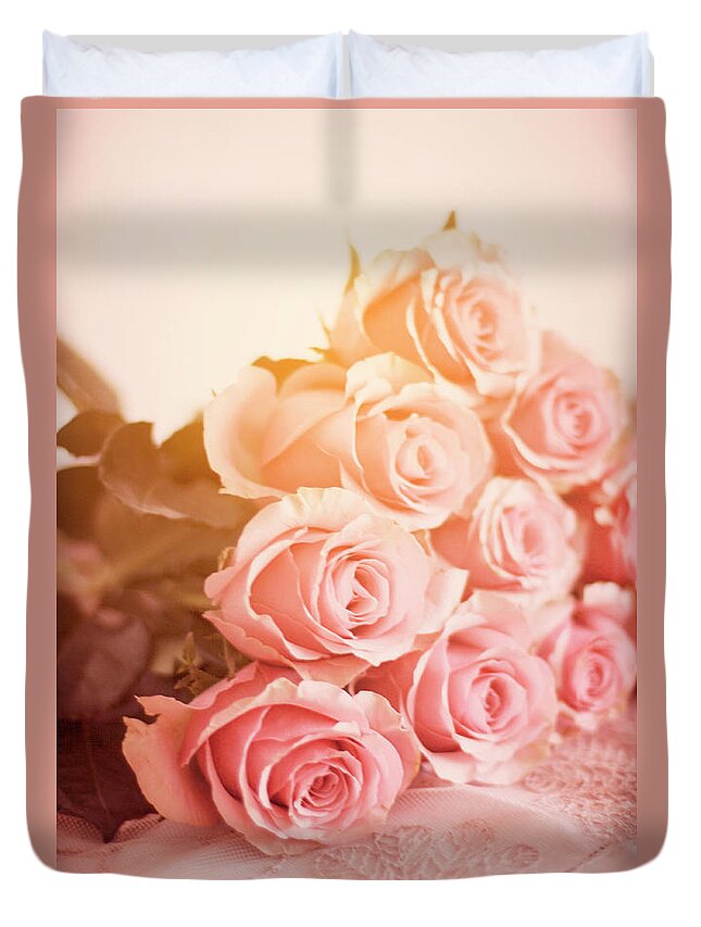 Roses Duvet Cover featuring the photograph Pink Roses Lying On A Table by Ethiriel Photography