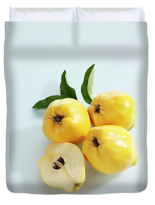 Shadow Duvet Cover featuring the photograph Quinces On White Background by Westend61