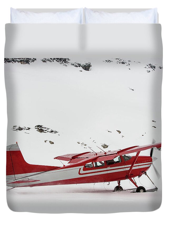 Tranquility Duvet Cover featuring the photograph Red Plane With Skis Taking Off In Snow by Robin Skjoldborg