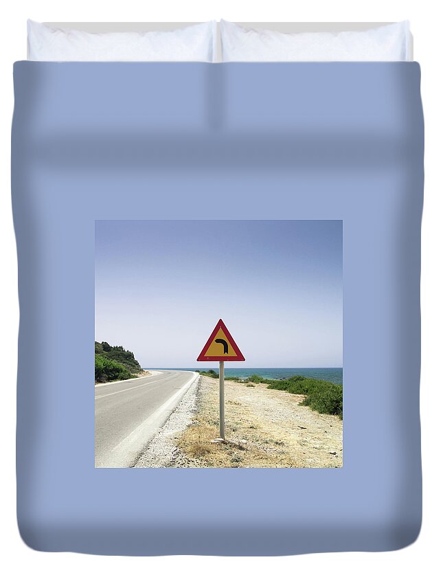 Tranquility Duvet Cover featuring the photograph Road With Traffic Sign And Sea by Halfoto.hu