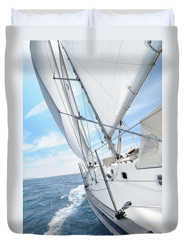 Eco Tourism Duvet Cover featuring the photograph Sailing Boat Under Sails Going Towars by Nikitje