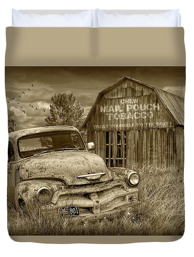 Chevy Duvet Cover featuring the photograph Sepia Tone of Rusted Chevy Pickup Truck in a Rural Landscape by a Mail Pouch Tobacco Barn by Randall Nyhof