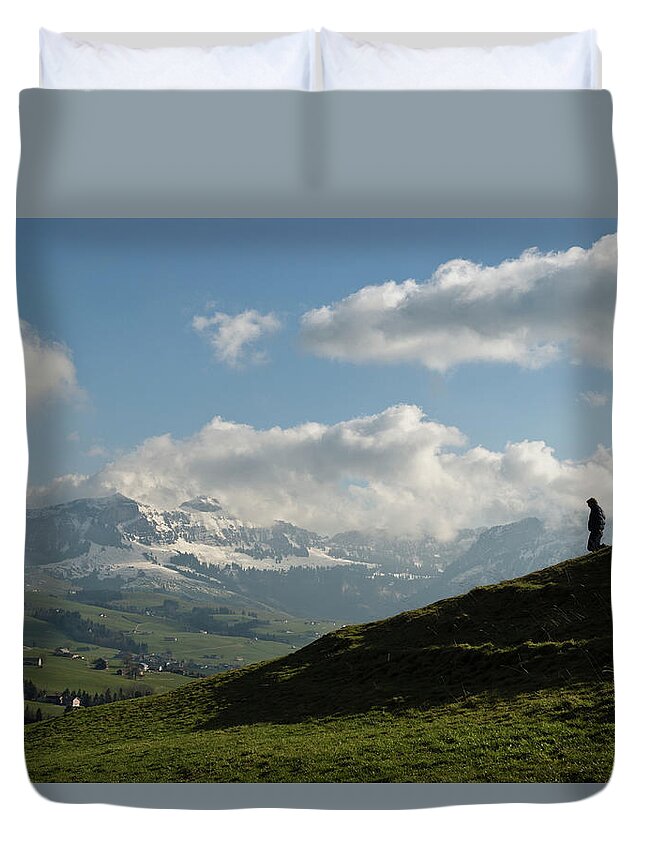 Grass Duvet Cover featuring the photograph Silhouette Of Man Moving Down Hill by Bryce Pincham