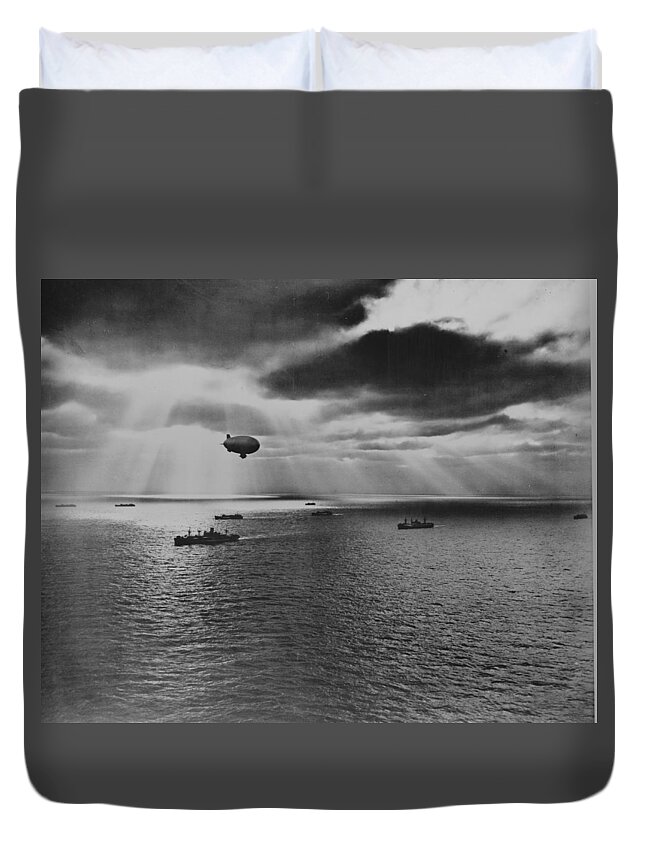 Sunset Duvet Cover featuring the painting Sunset over the Atlantic finds another United Nations convoy moving peacefully towards it destination. A U.S. Navy blimp, hovering watchfully overhead, is on the lookout for any sign of enemy submarines by 
