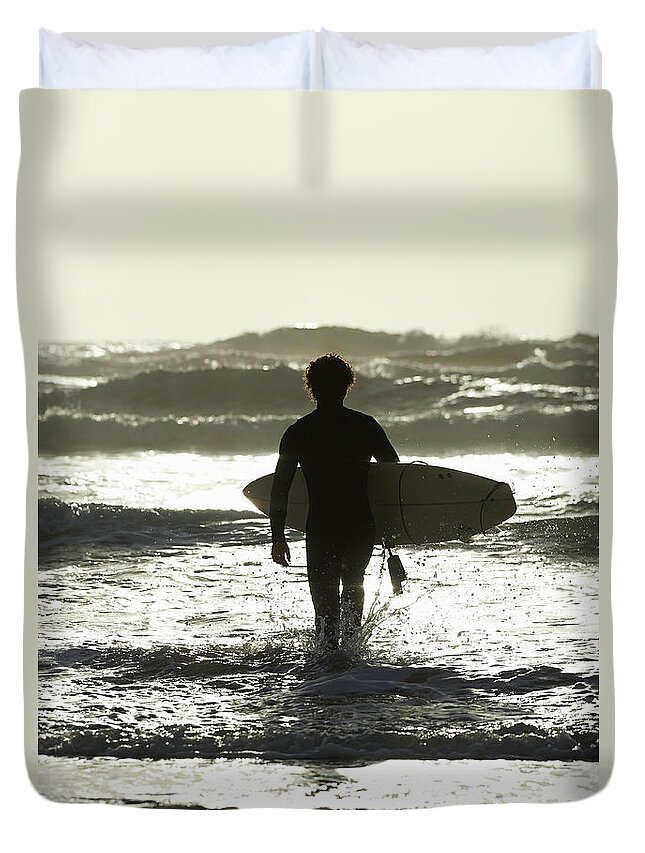 People Duvet Cover featuring the photograph Surfer Walking Out To Sea With Surfboard by Dougal Waters