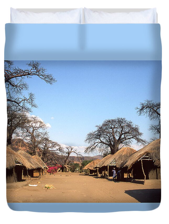 Tranquility Duvet Cover featuring the photograph Traditional Thatched Houses And Baobabs by © Santiago Urquijo