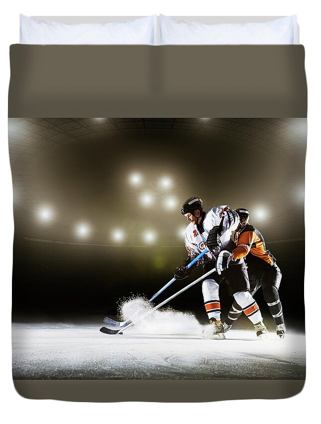 Sports Helmet Duvet Cover featuring the photograph Two Ice Hockey Players Competing For by Robert Decelis Ltd
