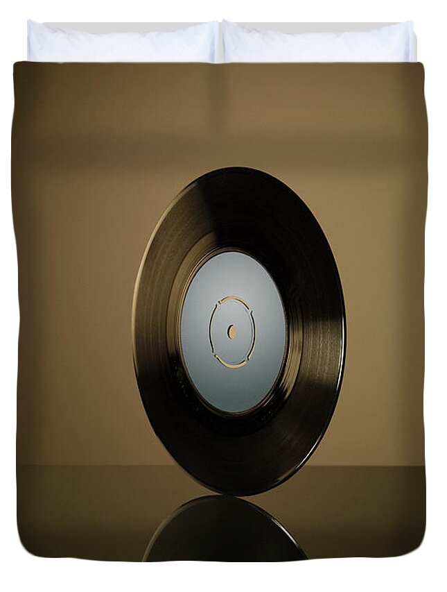 Music Duvet Cover featuring the photograph Vinyl Record On Reflective Surface by Jonathan Knowles