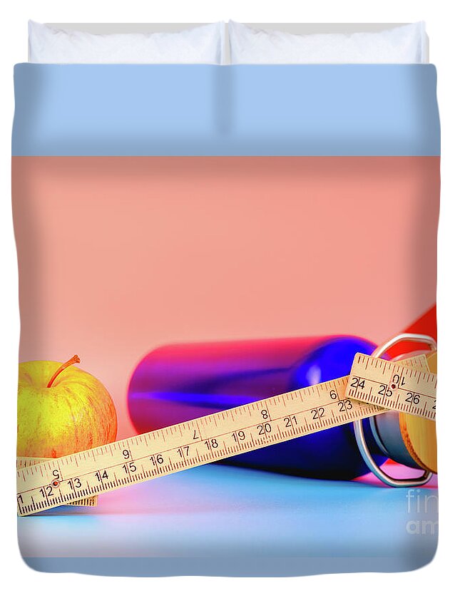 Apple Duvet Cover featuring the photograph Water bottle, apple and measuring tape isolated on colorful background in studio, healthy life concept. by Joaquin Corbalan
