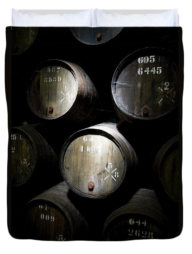 Alcohol Duvet Cover featuring the photograph Wine Barrels In A Cellar by Tobias Titz