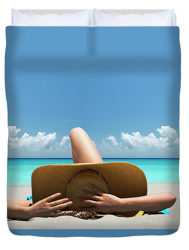 Tranquility Duvet Cover featuring the photograph Woman Laying On Towel On Beach by Lost Horizon Images