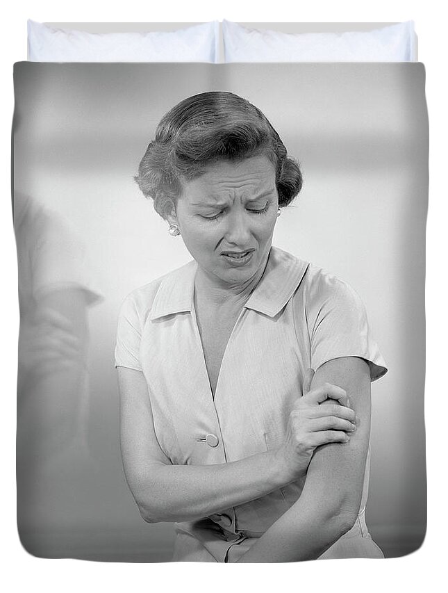 People Duvet Cover featuring the photograph Woman Massaging Arm by George Marks
