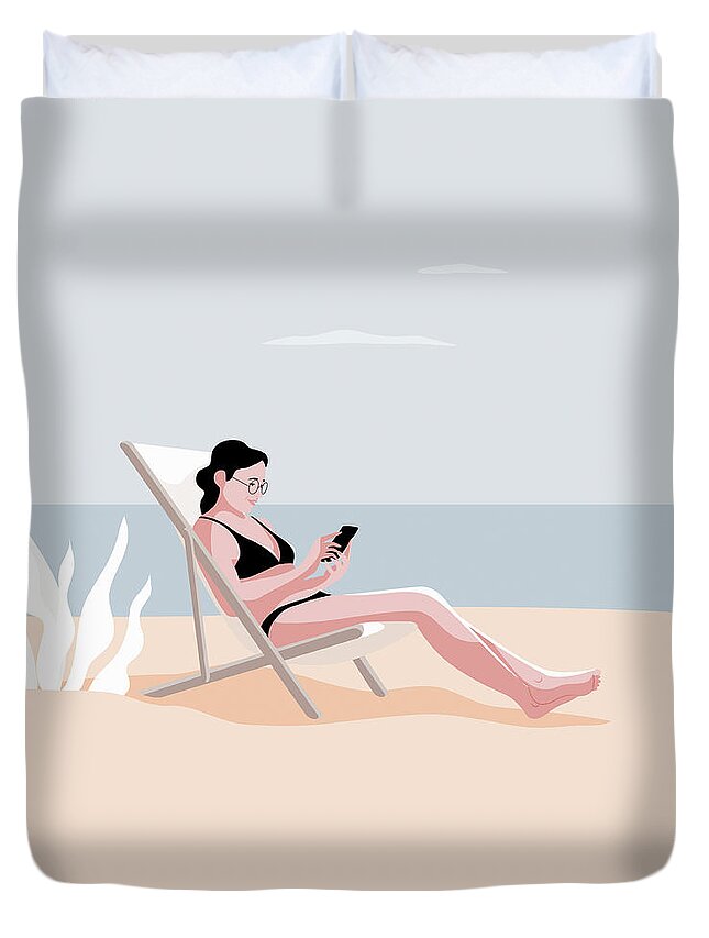 20-24 Duvet Cover featuring the photograph Woman Relaxing On Beach Using Smart by Ikon Images