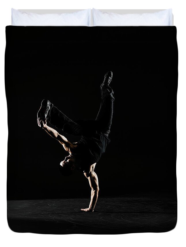 One Man Only Duvet Cover featuring the photograph Young Male Breakdancer Balancing On One by Thomas Barwick