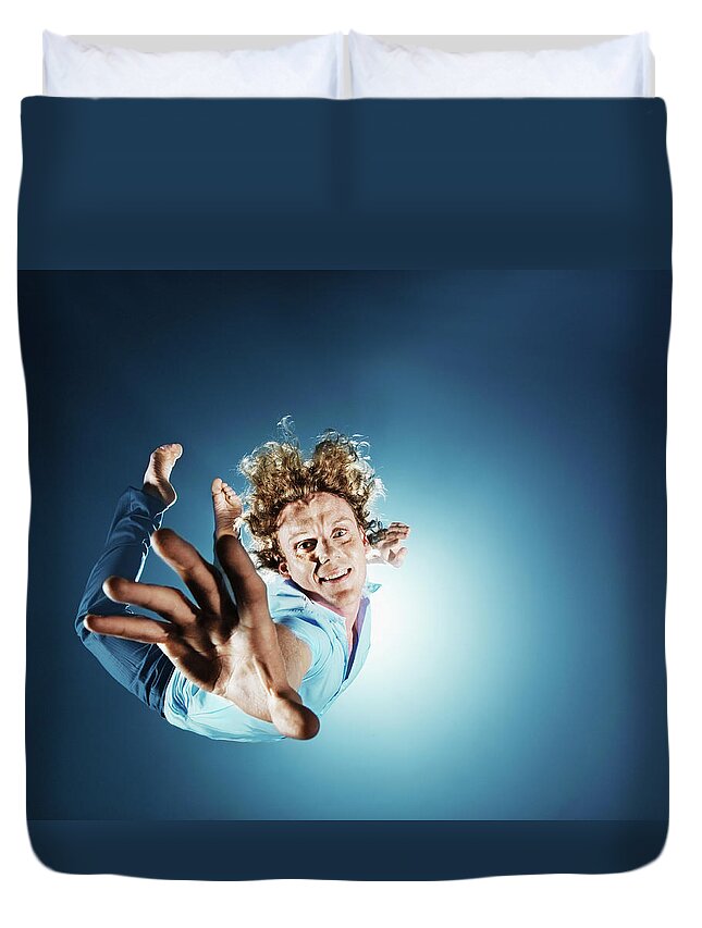 Human Arm Duvet Cover featuring the photograph Young Man Dreaming In Air, Smiling by Henrik Sorensen