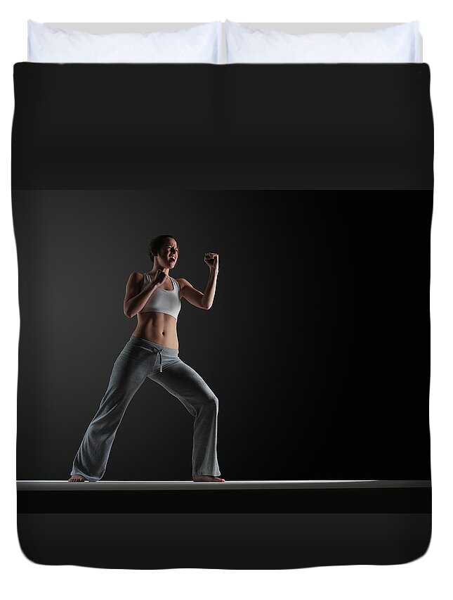 Expertise Duvet Cover featuring the photograph Young Woman Practising Karate, Close-up by John Lamb