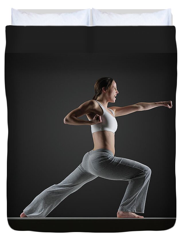Expertise Duvet Cover featuring the photograph Young Woman Practising Karate, Side View by John Lamb