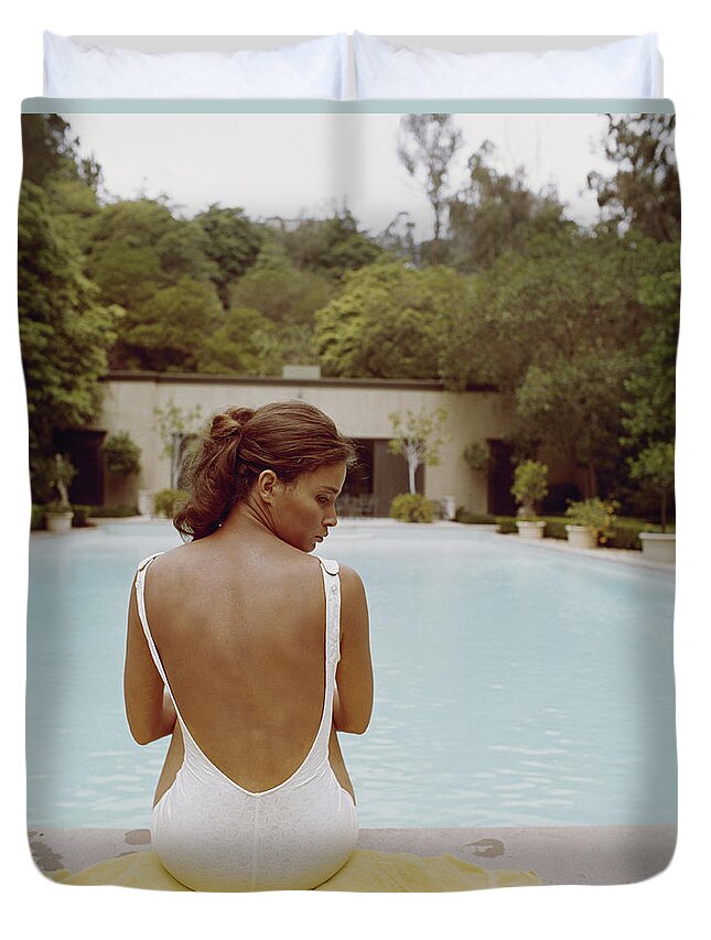 People Duvet Cover featuring the photograph Young Woman Sitting At Edge Of Swimming by Tom Kelley Archive
