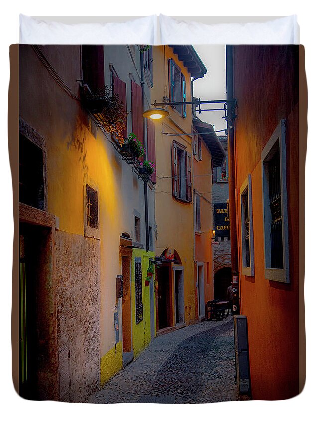 Tourism Duvet Cover featuring the photograph A Quiet Stroll in Malcesine by W Chris Fooshee