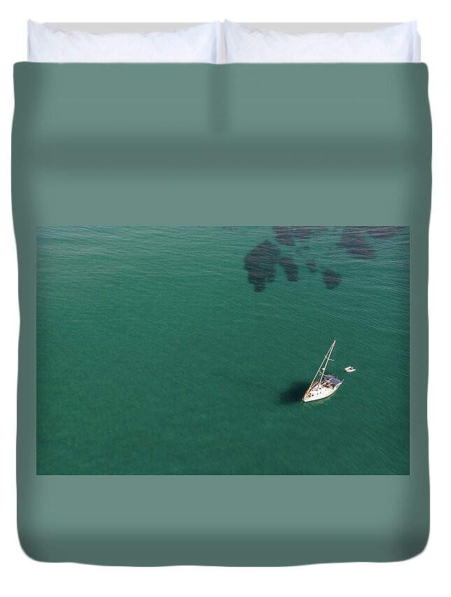 Anchored Duvet Cover featuring the photograph Aerial view of a luxury yacht anchored in the surface of the sea. Cyprus vacations by Michalakis Ppalis
