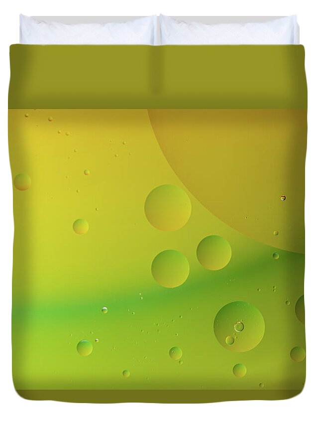 Connection Duvet Cover featuring the photograph Bright abstract green and yellow background with flying bubbles by Michalakis Ppalis