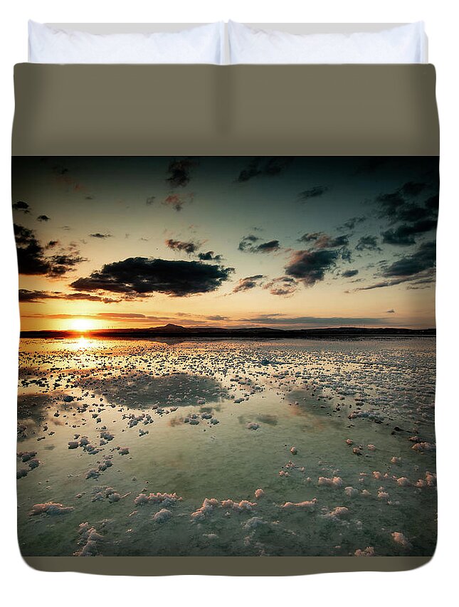 Sunset Duvet Cover featuring the photograph Dramatic winter sunset in the lake. by Michalakis Ppalis