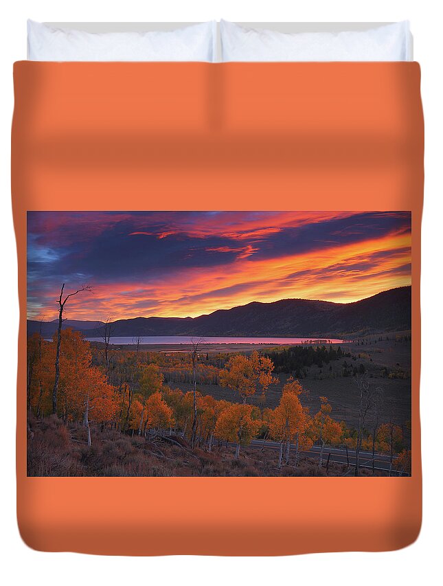 Fishlake Duvet Cover featuring the photograph Fiery autumn sunrise at Fish Lake in Utah by Jetson Nguyen