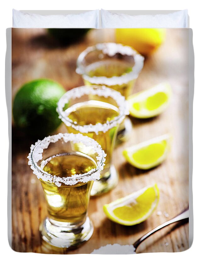 Tequila Duvet Cover featuring the photograph Golden mexican tequila in shot glasses by Jelena Jovanovic