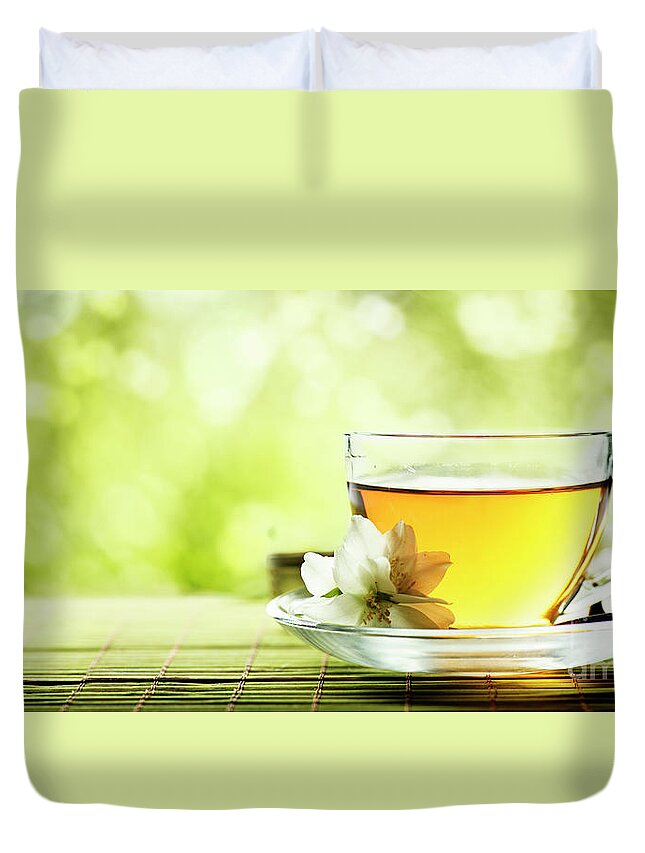 Tea Duvet Cover featuring the photograph Herbal cup of tea on wooden table by Jelena Jovanovic